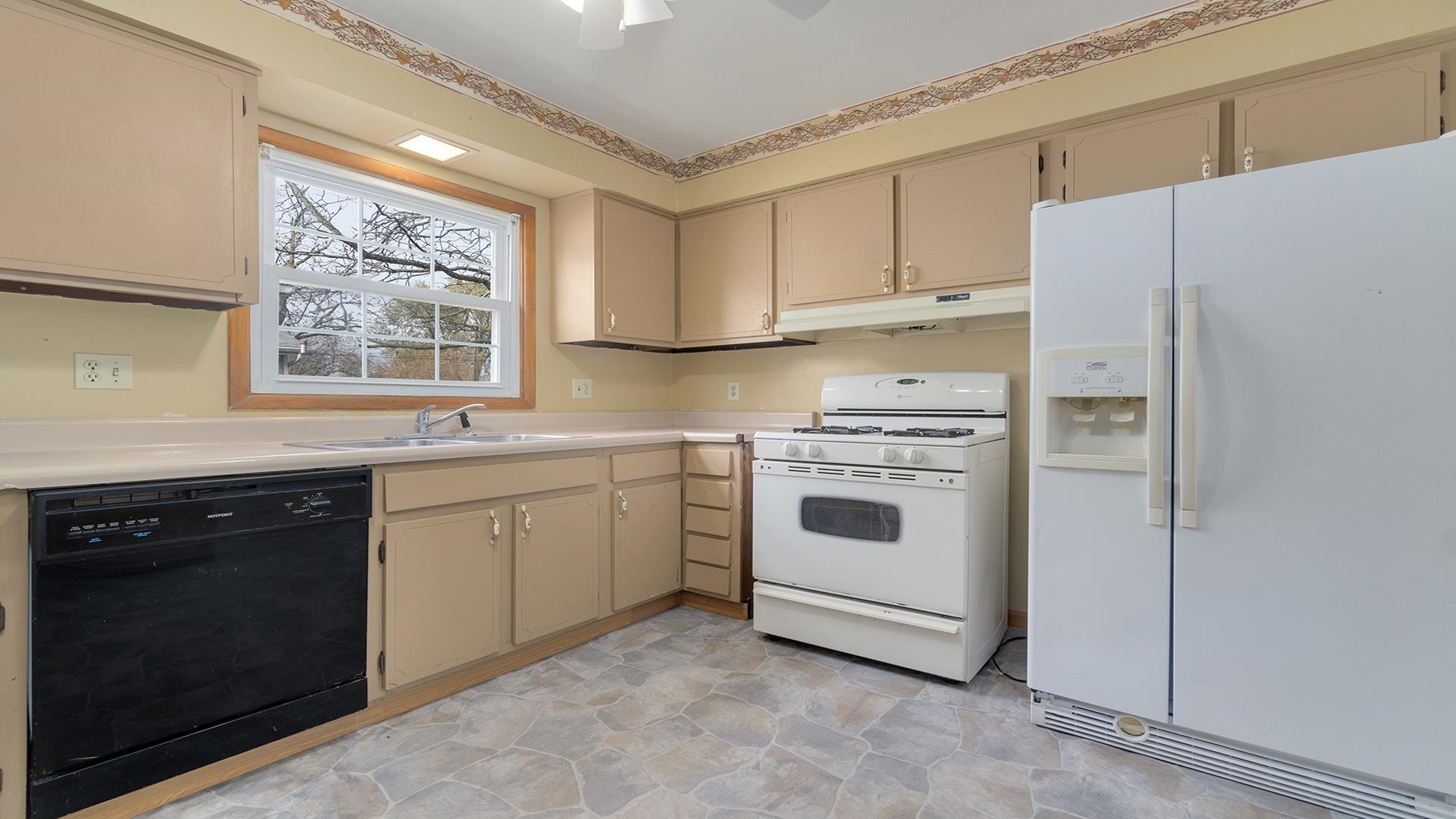 345 Irene Avenue Rochelle, IL 61068 - Photo 16 of 27 a kitchen with white cabinets and white appliances