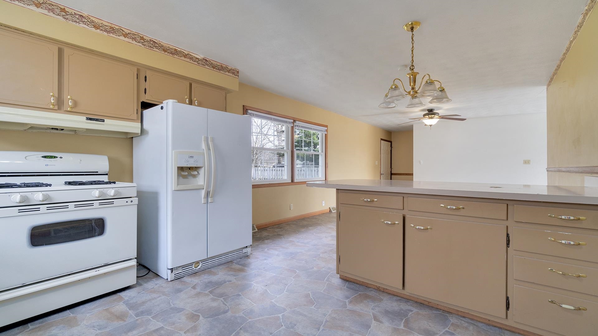345 Irene Avenue Rochelle, IL 61068 - Photo 17 of 27 a kitchen with granite countertop cabinets and stainless steel appliances