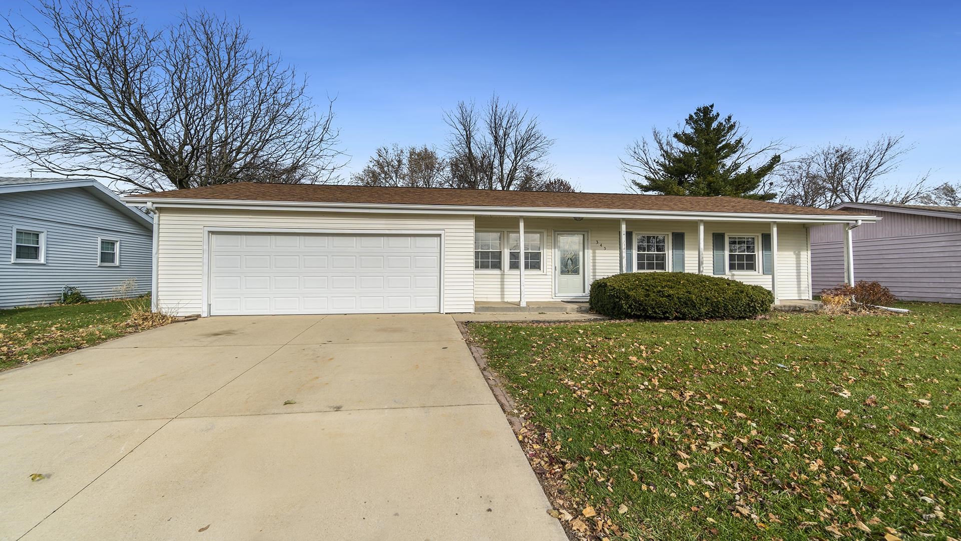 345 Irene Avenue Rochelle, IL 61068 - Photo 26 of 27 a front view of house with yard and trees around