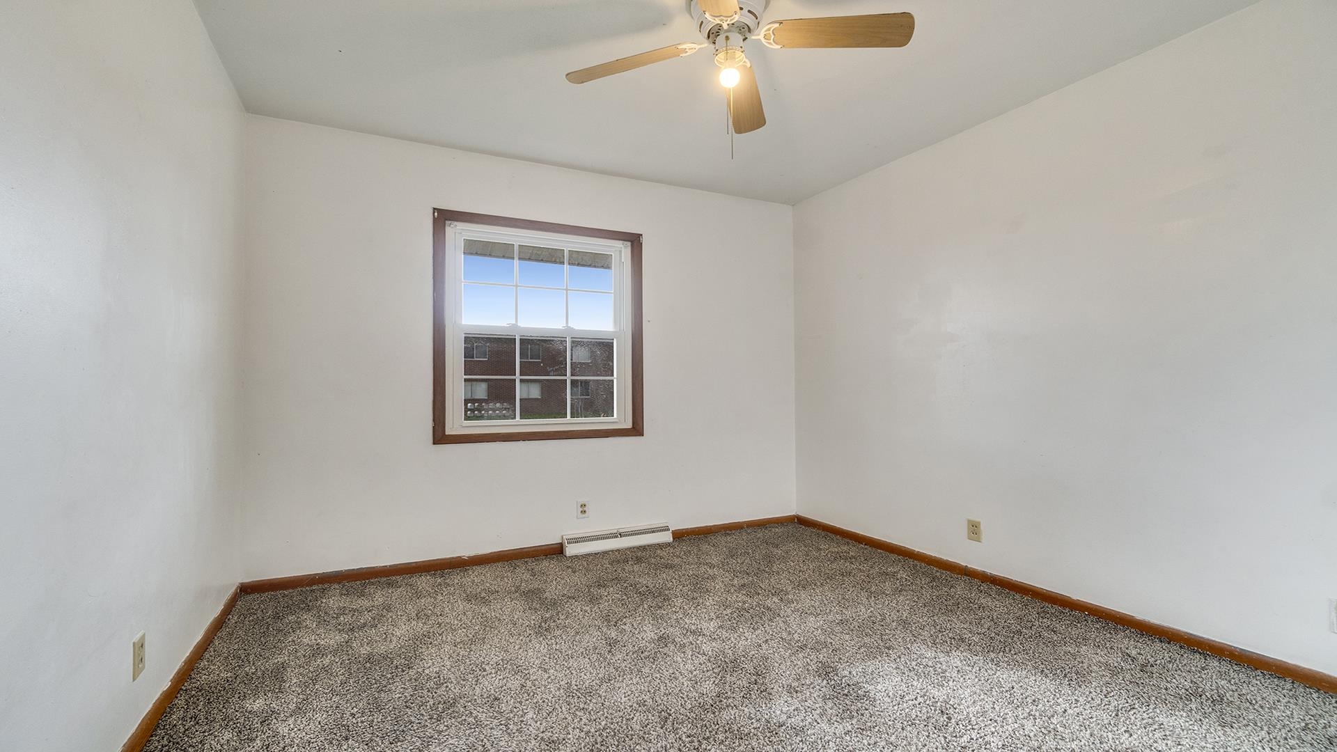 345 Irene Avenue Rochelle, IL 61068 - Photo 6 of 27 an empty room with a window