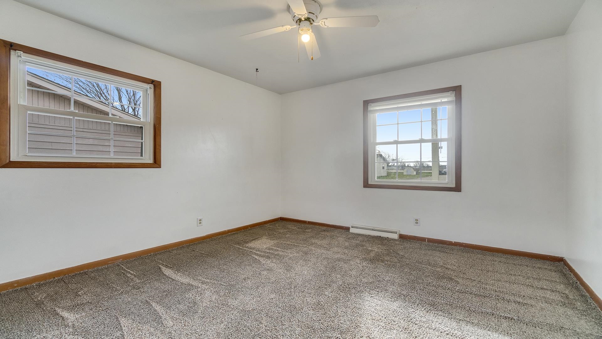 345 Irene Avenue Rochelle, IL 61068 - Photo 8 of 27 a view of an empty room with a window
