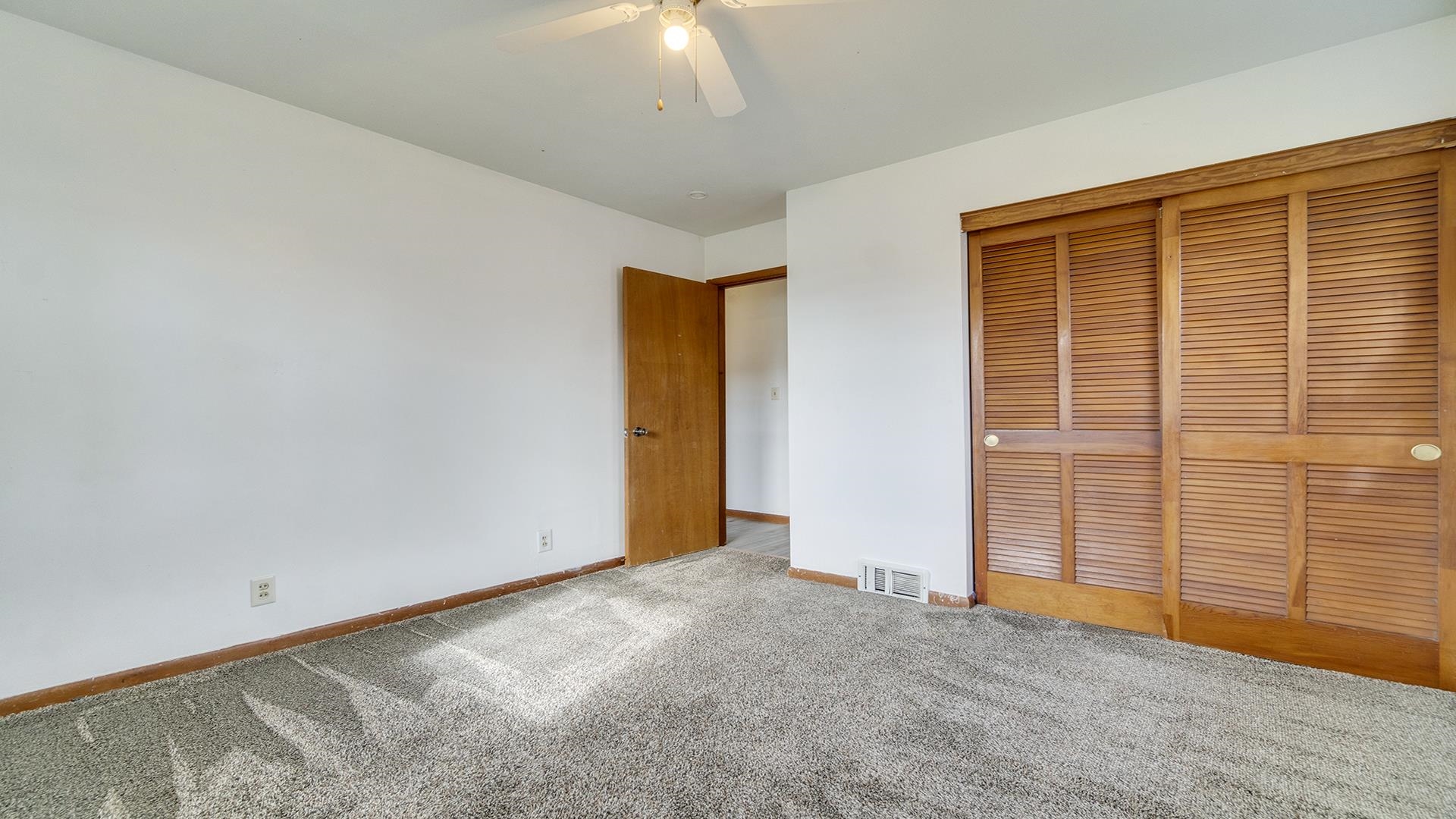 345 Irene Avenue Rochelle, IL 61068 - Photo 9 of 27 an empty room with windows