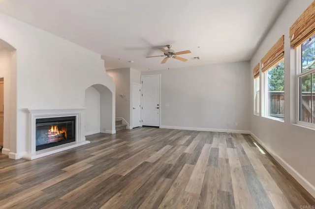 a kitchen with a refrigerator and a stove top oven