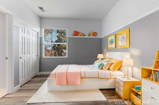a view of patio with chairs and table under an umbrella