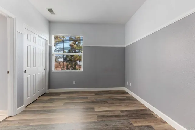 a bathroom with a sink toilet vanity and shower