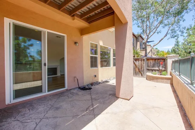 a view of a street with potted plants