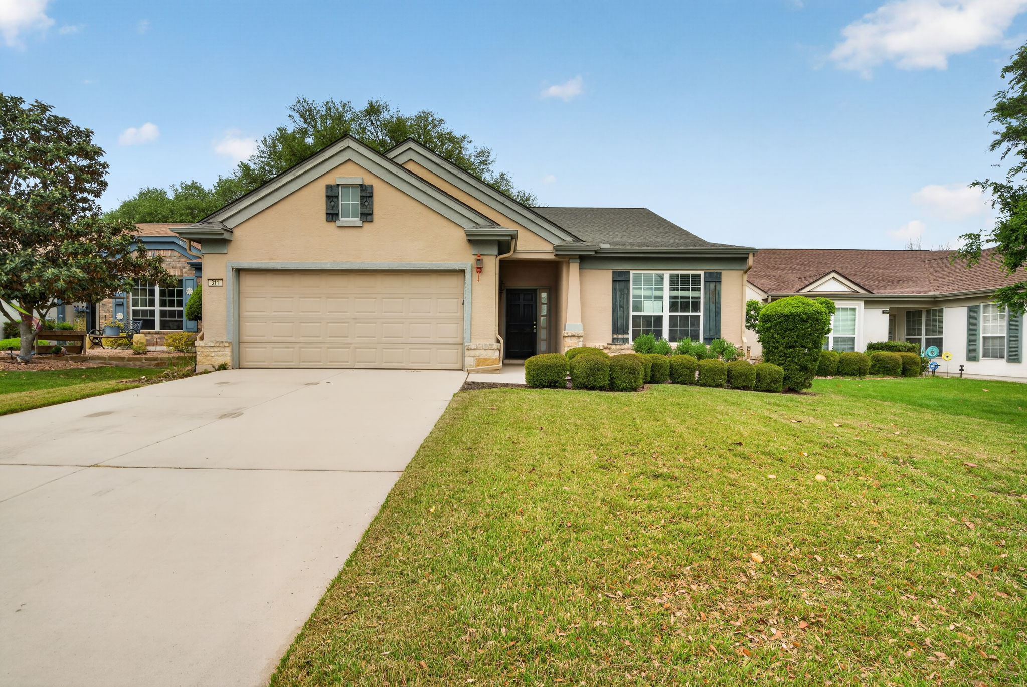 311 Deer Meadow Circle Georgetown, TX 78633 - Photo 1 of 19 a front view of a house with garden
