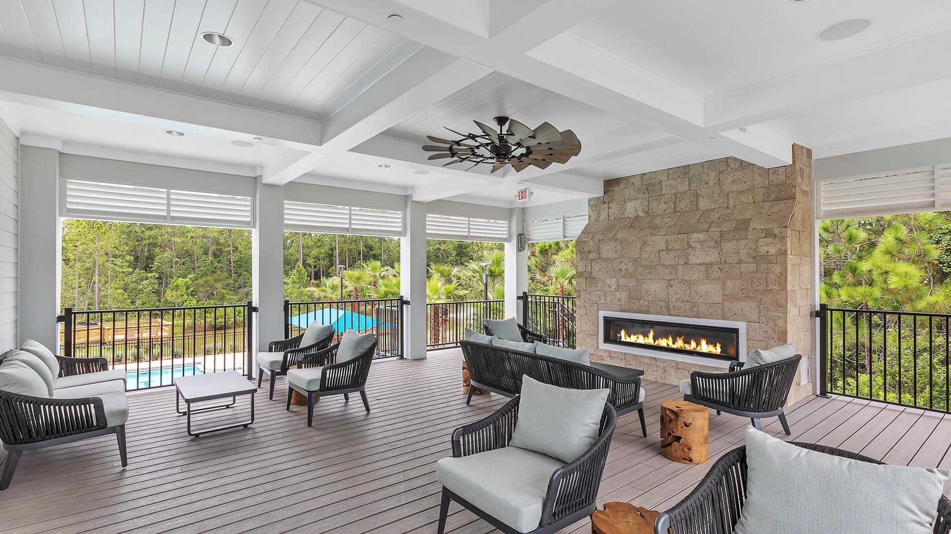681 Grand Reserve Drive Bunnell, FL 32110 - Photo 17 of 26 a living room with furniture and a floor to ceiling window