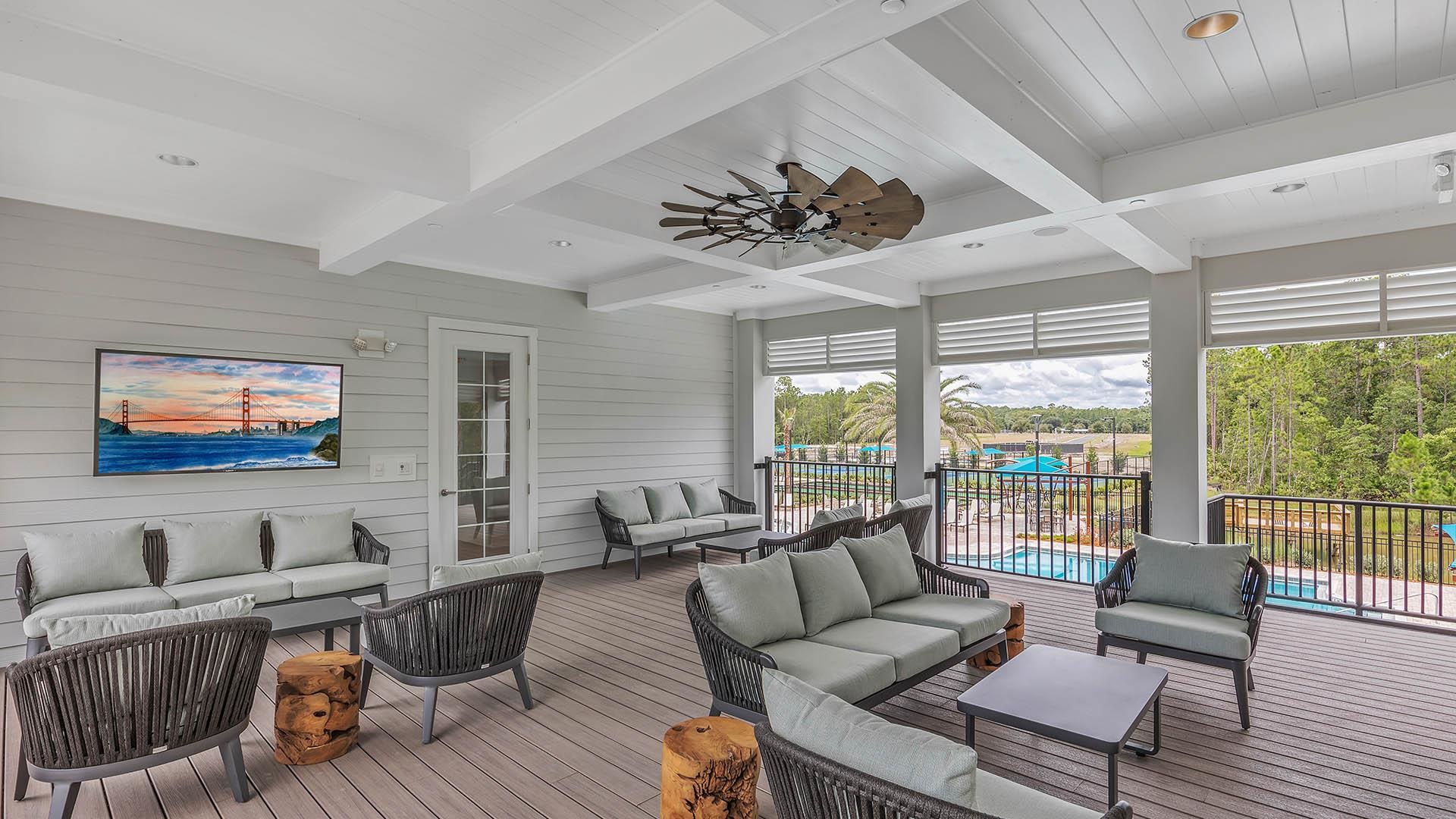 681 Grand Reserve Drive Bunnell, FL 32110 - Photo 18 of 26 a living room with furniture ceiling fan and a large window