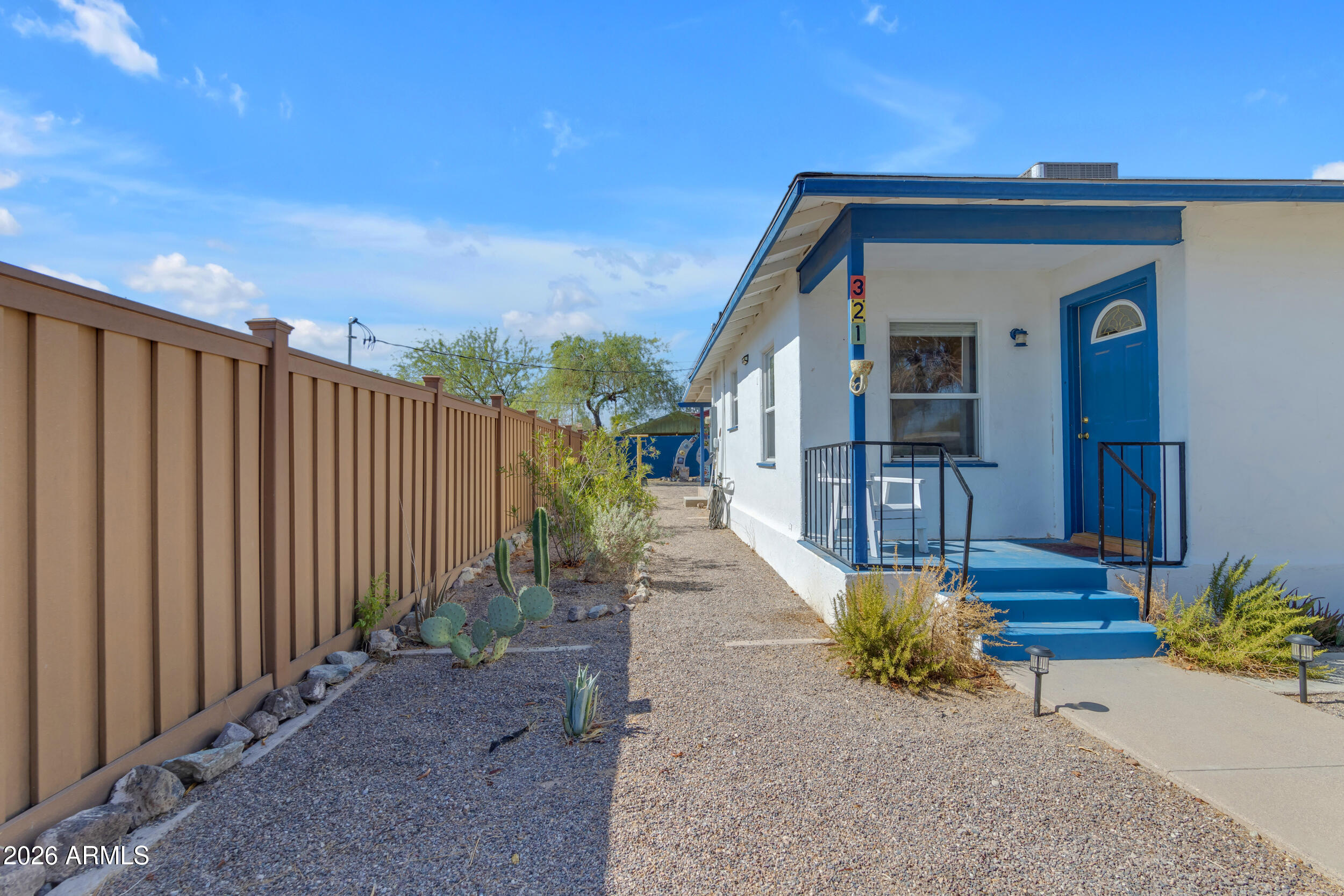 321 Solana Avenue Ajo, AZ 85321 - Photo 2 of 20 a house with wooden fence