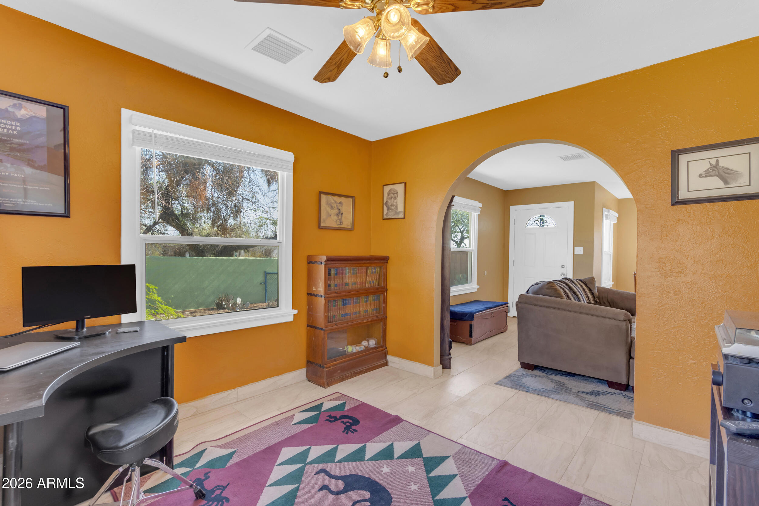 321 Solana Avenue Ajo, AZ 85321 - Photo 9 of 20 a living room with furniture and a flat screen tv