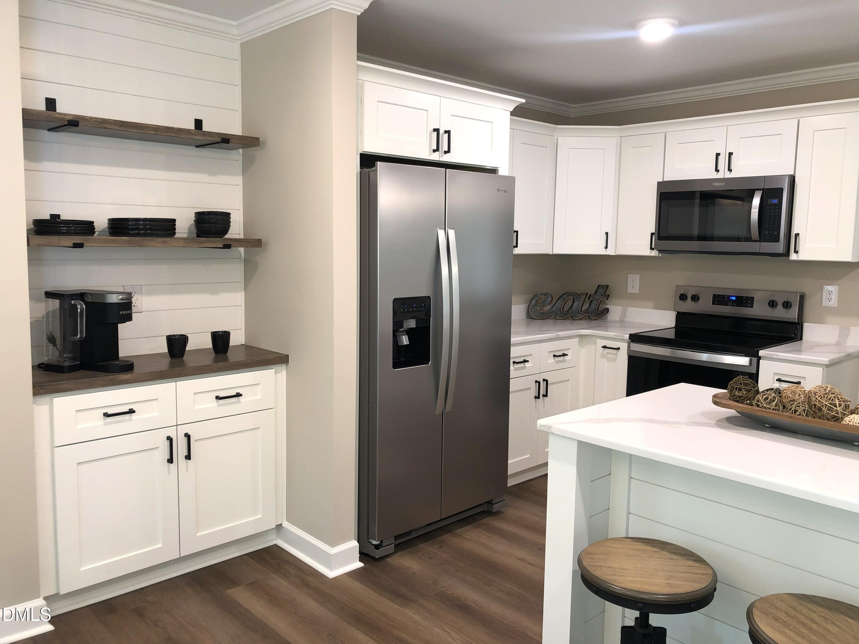 95 Smith Taylor Trail Roxboro, NC 27574 - Photo 3 of 47 a kitchen with stainless steel appliances a refrigerator stove and microwave