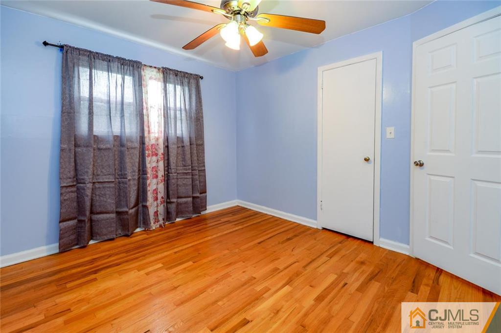 16 Stockton Road New Brunswick, NJ 08901 - Photo 11 of 25 a view of empty room with window and ceiling fan