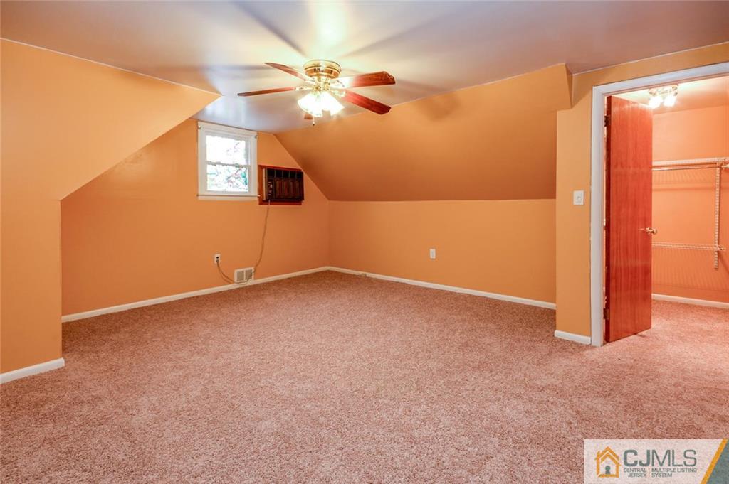 16 Stockton Road New Brunswick, NJ 08901 - Photo 20 of 25 an empty room with a fan & a window