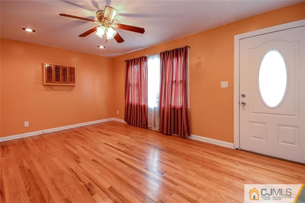 16 Stockton Road New Brunswick, NJ 08901 - Photo 3 of 25 a view of a livingroom with a fan