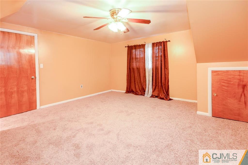 16 Stockton Road New Brunswick, NJ 08901 - Photo 21 of 25 a view of a room with a ceiling fan and a window