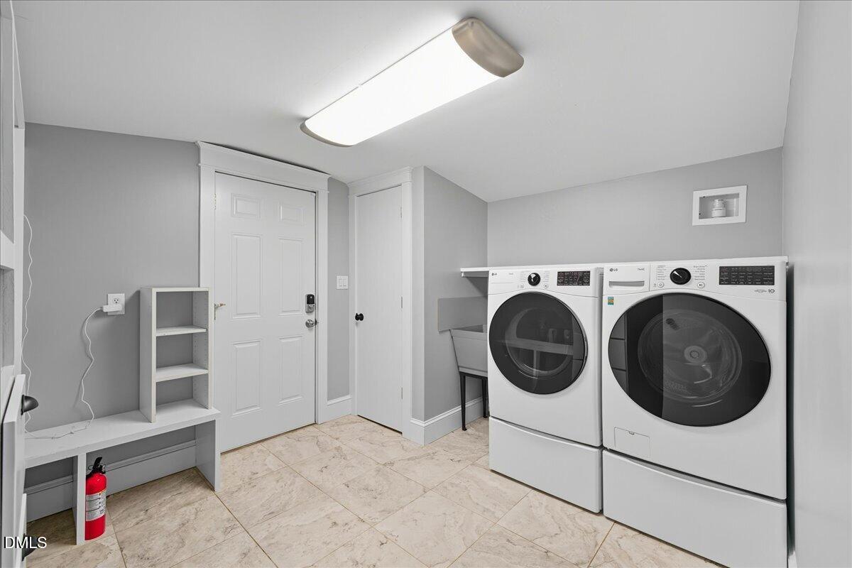 709 Winterlochen Road Raleigh, NC 27603 - Photo 17 of 52 a utility room with dryer and washer