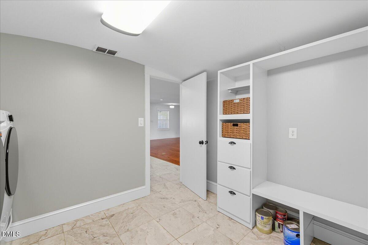 709 Winterlochen Road Raleigh, NC 27603 - Photo 18 of 52 an empty room with closet and wooden floor