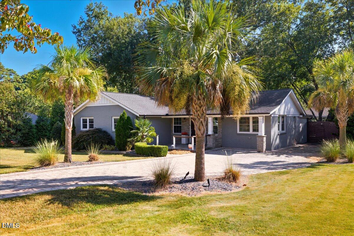 709 Winterlochen Road Raleigh, NC 27603 - Photo 2 of 52 a front view of a house with swimming pool