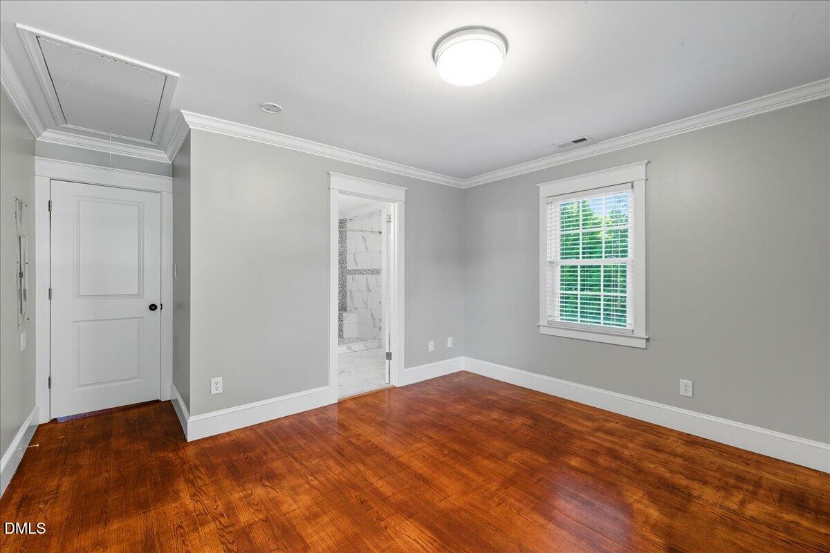 709 Winterlochen Road Raleigh, NC 27603 - Photo 27 of 52 a view of empty room with wooden floor