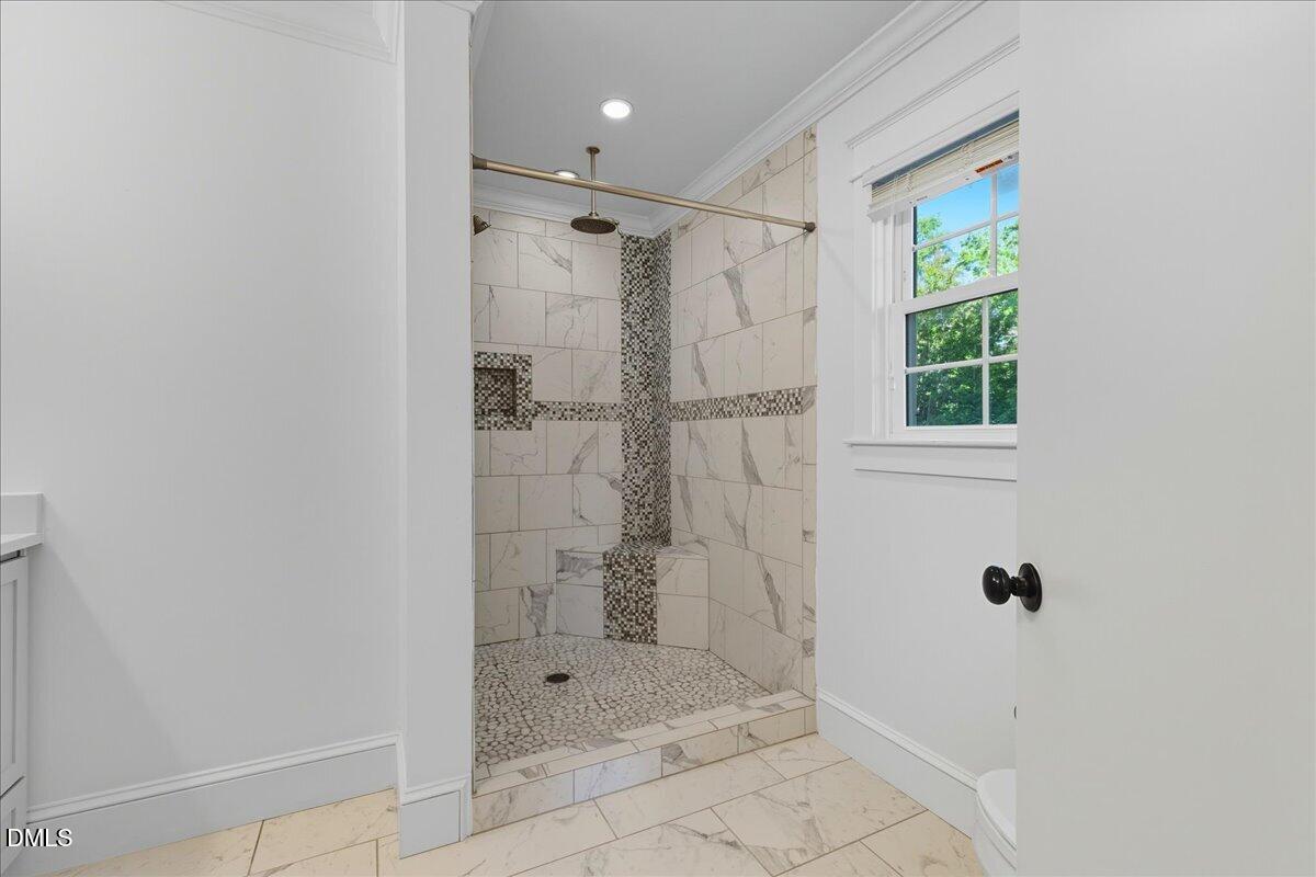 709 Winterlochen Road Raleigh, NC 27603 - Photo 28 of 52 a bathroom with a shower