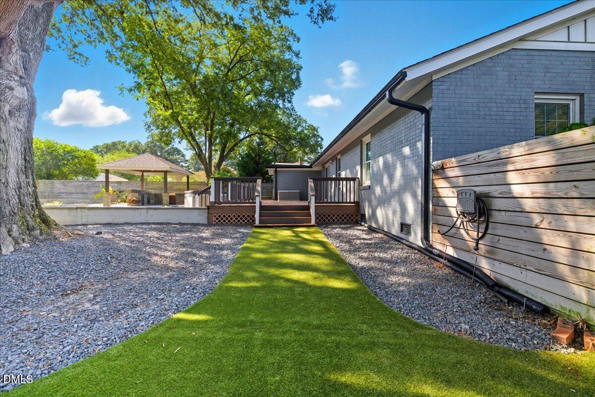 709 Winterlochen Road Raleigh, NC 27603 - Photo 34 of 52 a view of a house with a yard