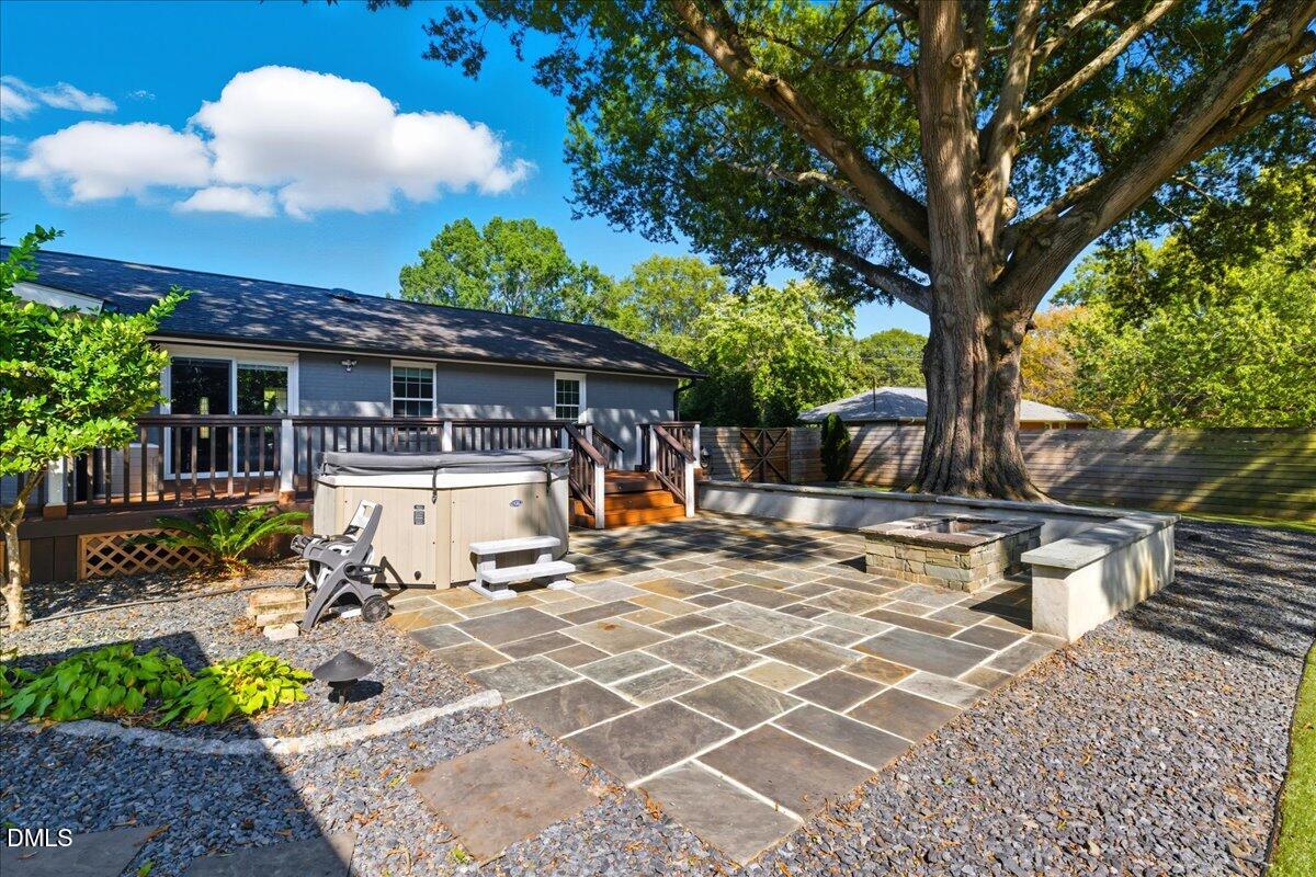 709 Winterlochen Road Raleigh, NC 27603 - Photo 35 of 52 a view of a patio with a table and chairs under an umbrella