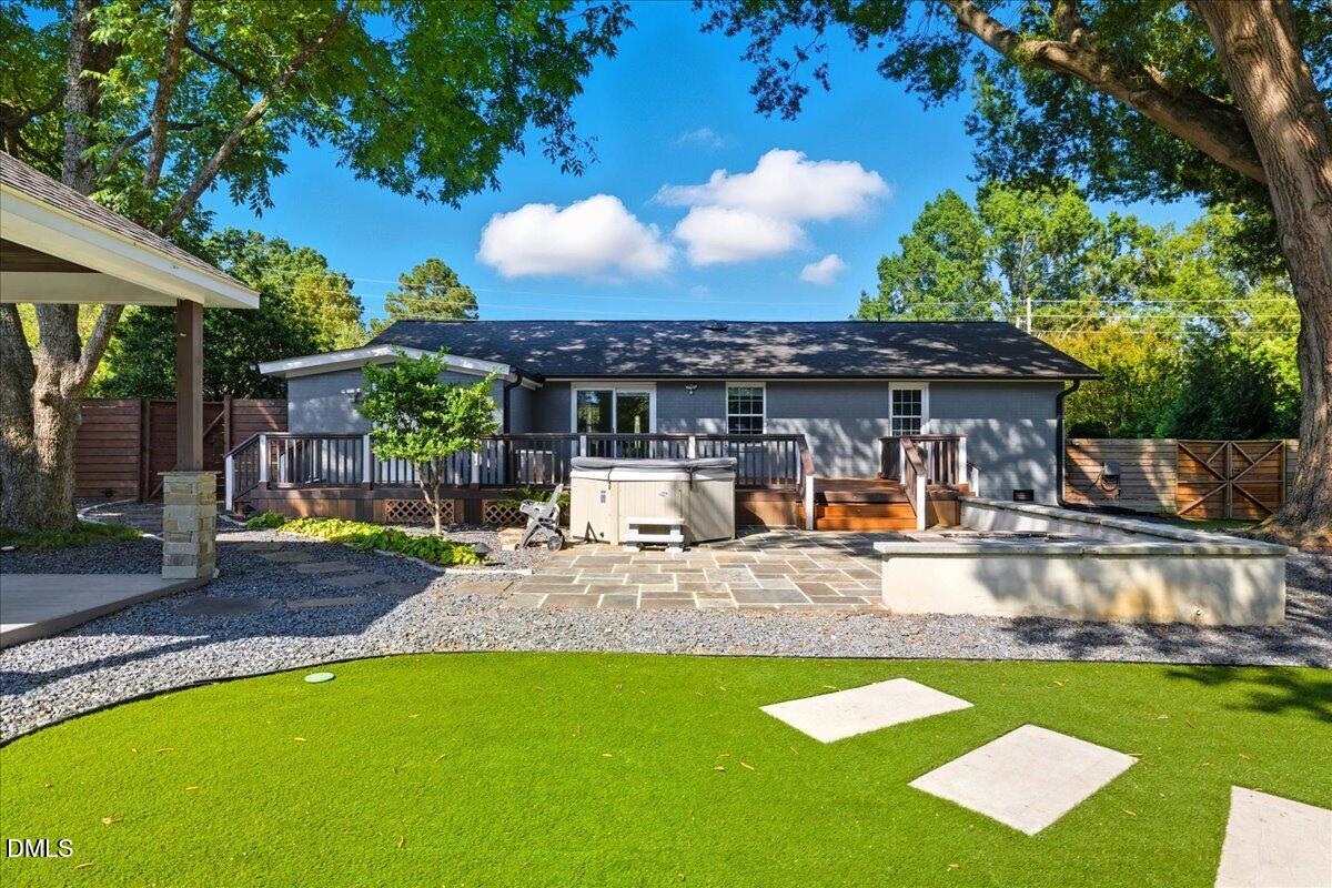 709 Winterlochen Road Raleigh, NC 27603 - Photo 36 of 52 a view of a house with backyard and sitting area