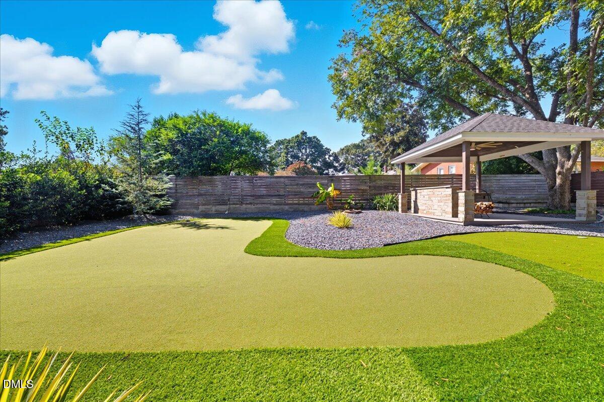709 Winterlochen Road Raleigh, NC 27603 - Photo 42 of 52 a view of a swimming pool with an outdoor space and seating area