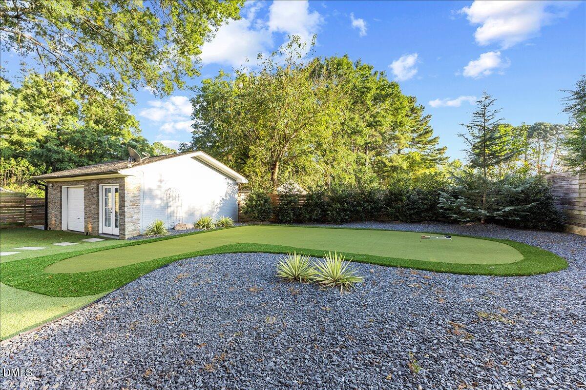 709 Winterlochen Road Raleigh, NC 27603 - Photo 44 of 52 a view of a backyard with large trees