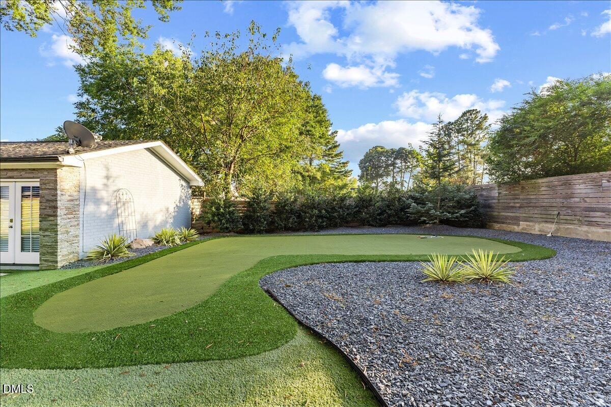 709 Winterlochen Road Raleigh, NC 27603 - Photo 45 of 52 a view of a backyard with large trees