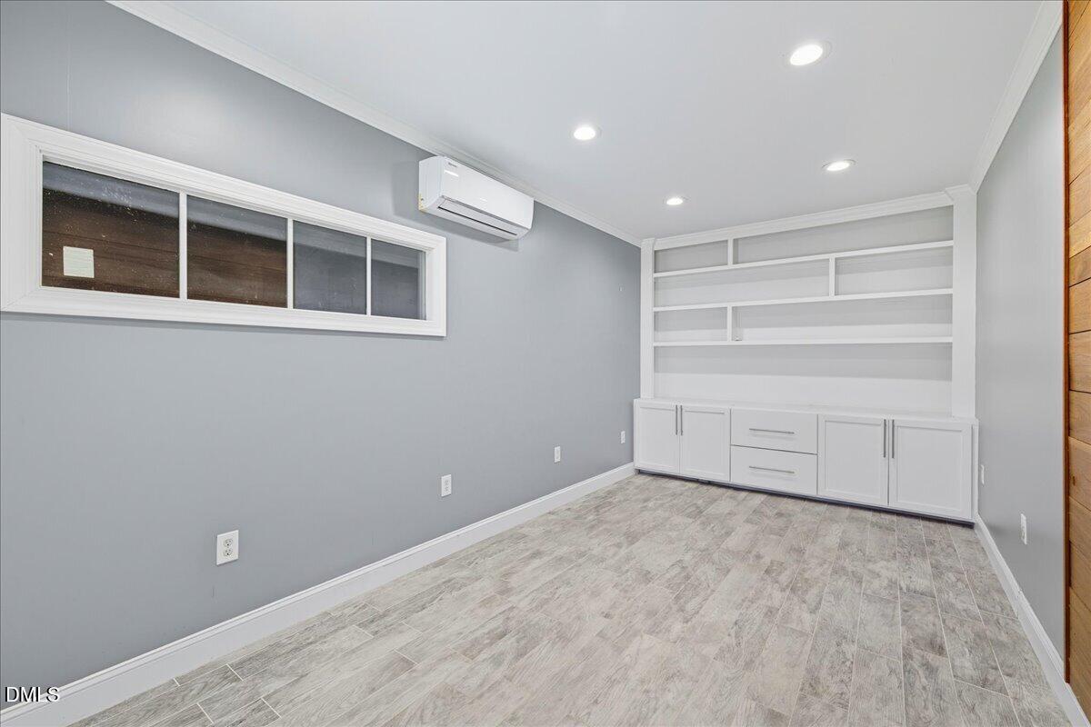 709 Winterlochen Road Raleigh, NC 27603 - Photo 50 of 52 a view of an empty room with a window