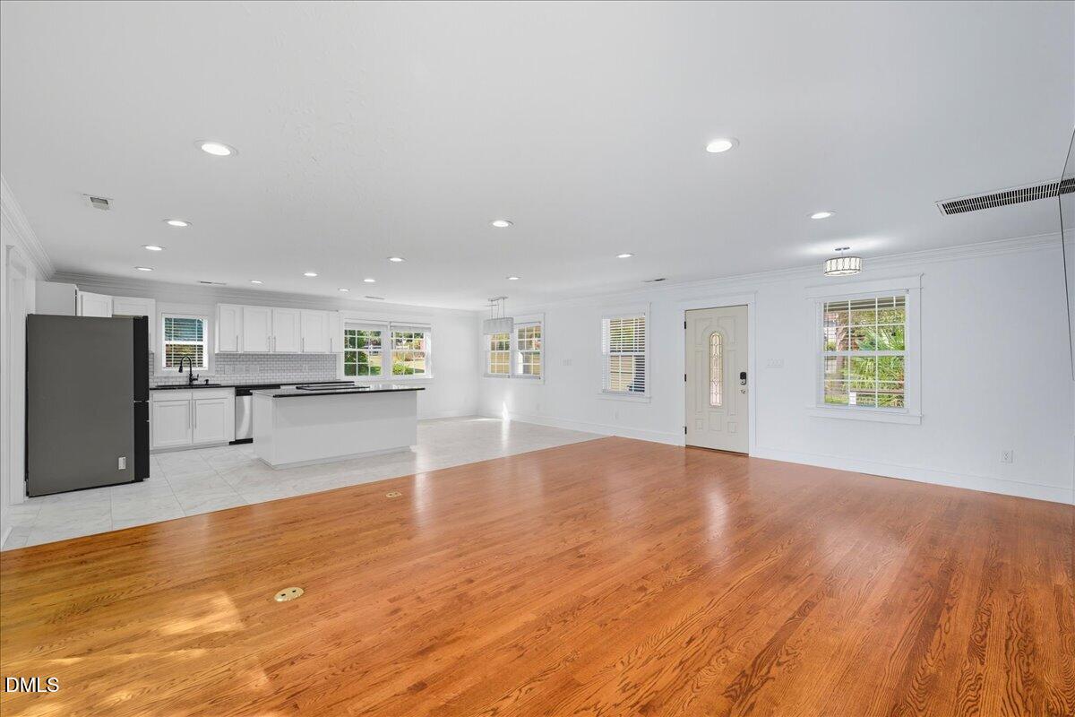 709 Winterlochen Road Raleigh, NC 27603 - Photo 10 of 52 a view of a kitchen with a sink and a refrigerator