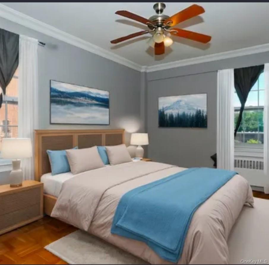 220 Pelham Road, Unit 3F New Rochelle, NY 10805 - Photo 5 of 25 Bedroom featuring crown molding, radiator, and ceiling fan