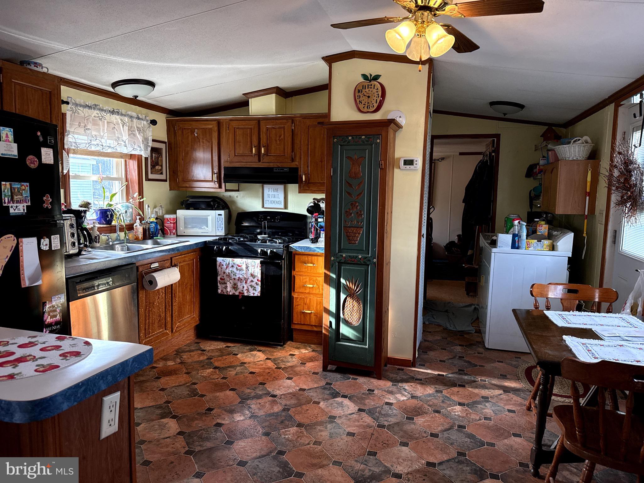 282 Michael Street Elizabethtown, PA 17022 - Photo 8 of 19 a kitchen with stainless steel appliances granite countertop a sink a stove a refrigerator and a dining table