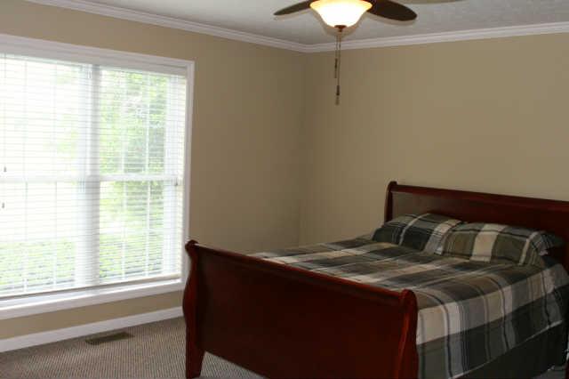 2504 Pleasant View Road Pleasant View, TN 37146 - Photo 8 of 20 The main floor master offers large windows for lots of natural lighting, walk in closet and bath with jetted tub and separate shower.