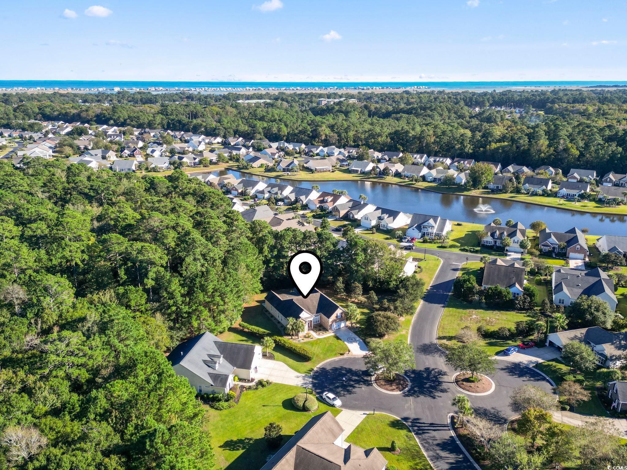 13 Grovecrest Drive Murrells Inlet, SC 29576 - Photo 36 of 40 Aerial perspective of suburban area featuring a large body of water