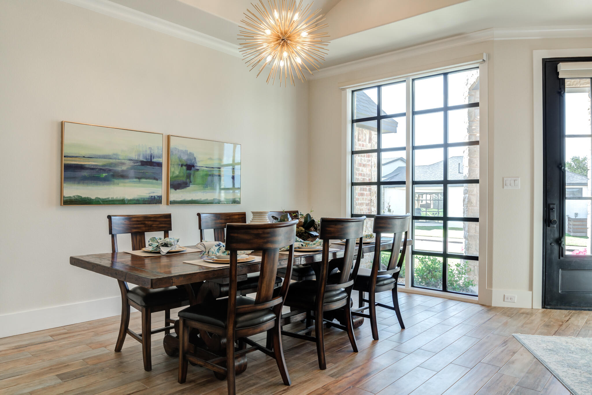4801 118th Street Lubbock, TX 79424 - Photo 11 of 74 a view of a dining room with furniture window and wooden floor