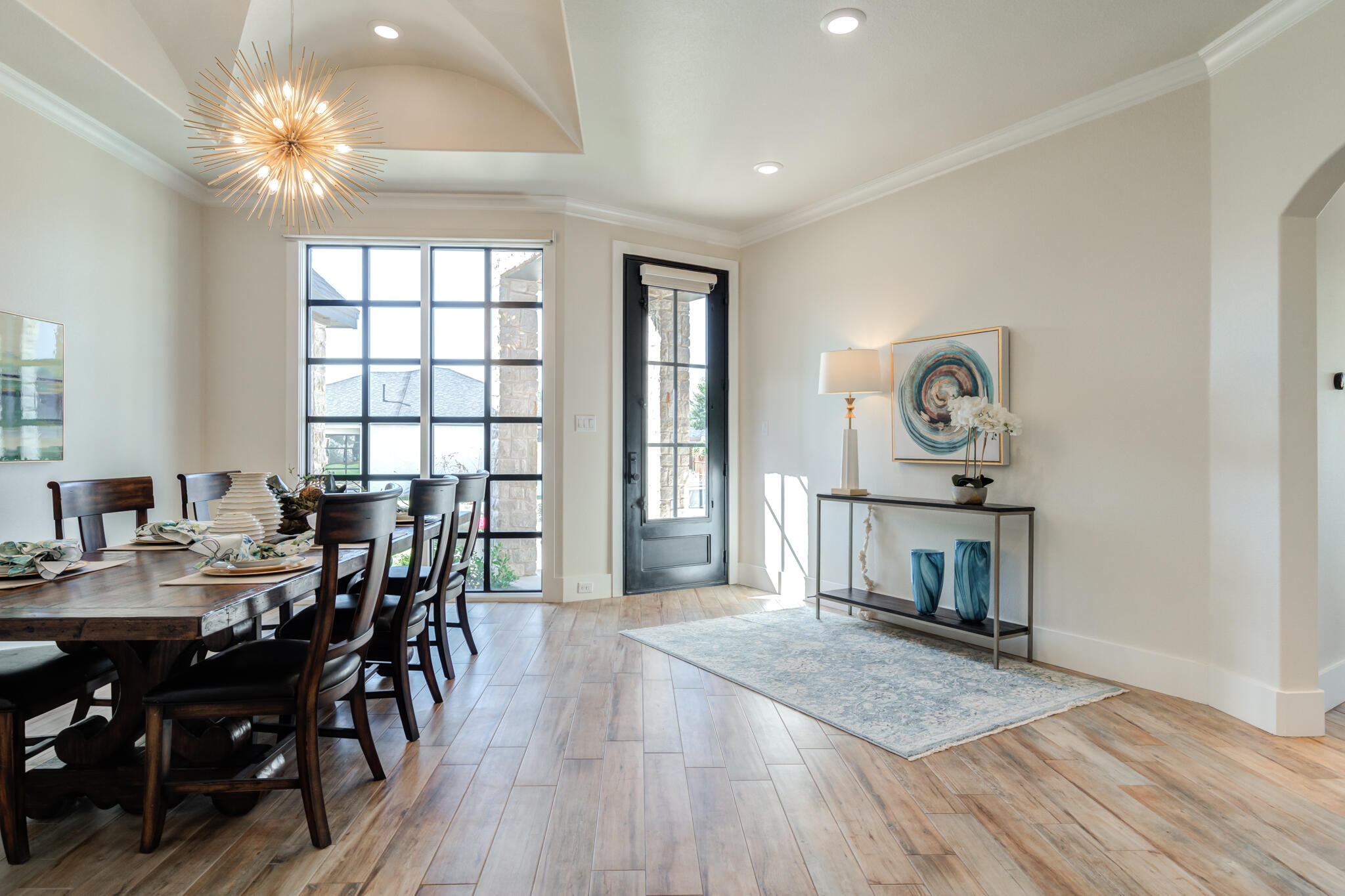 4801 118th Street Lubbock, TX 79424 - Photo 13 of 74 a view of a dining room with furniture window and wooden floor