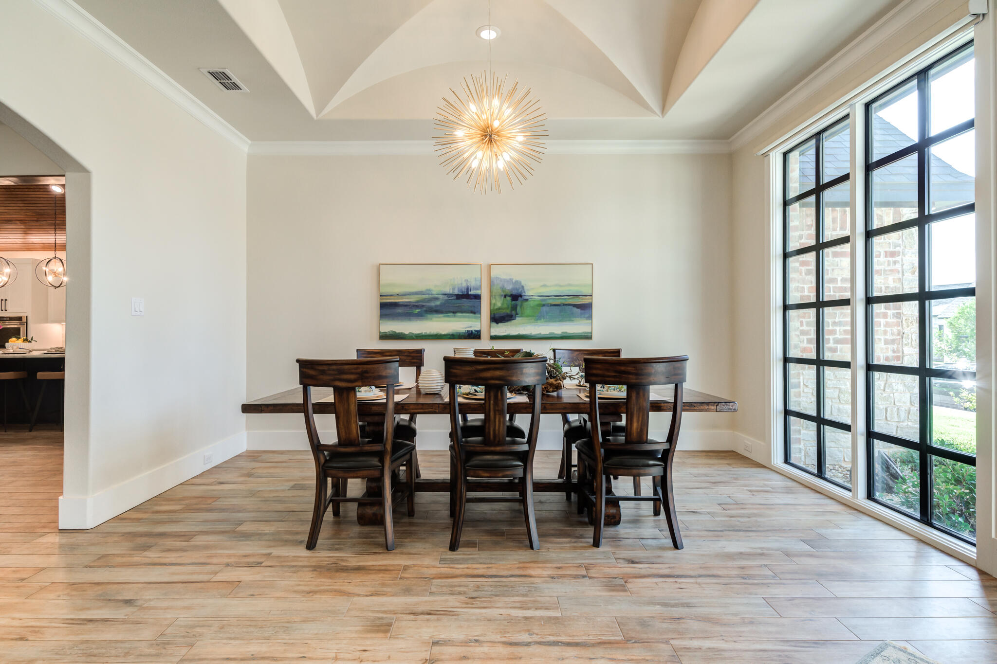 4801 118th Street Lubbock, TX 79424 - Photo 14 of 74 a view of a dining room with furniture window and wooden floor
