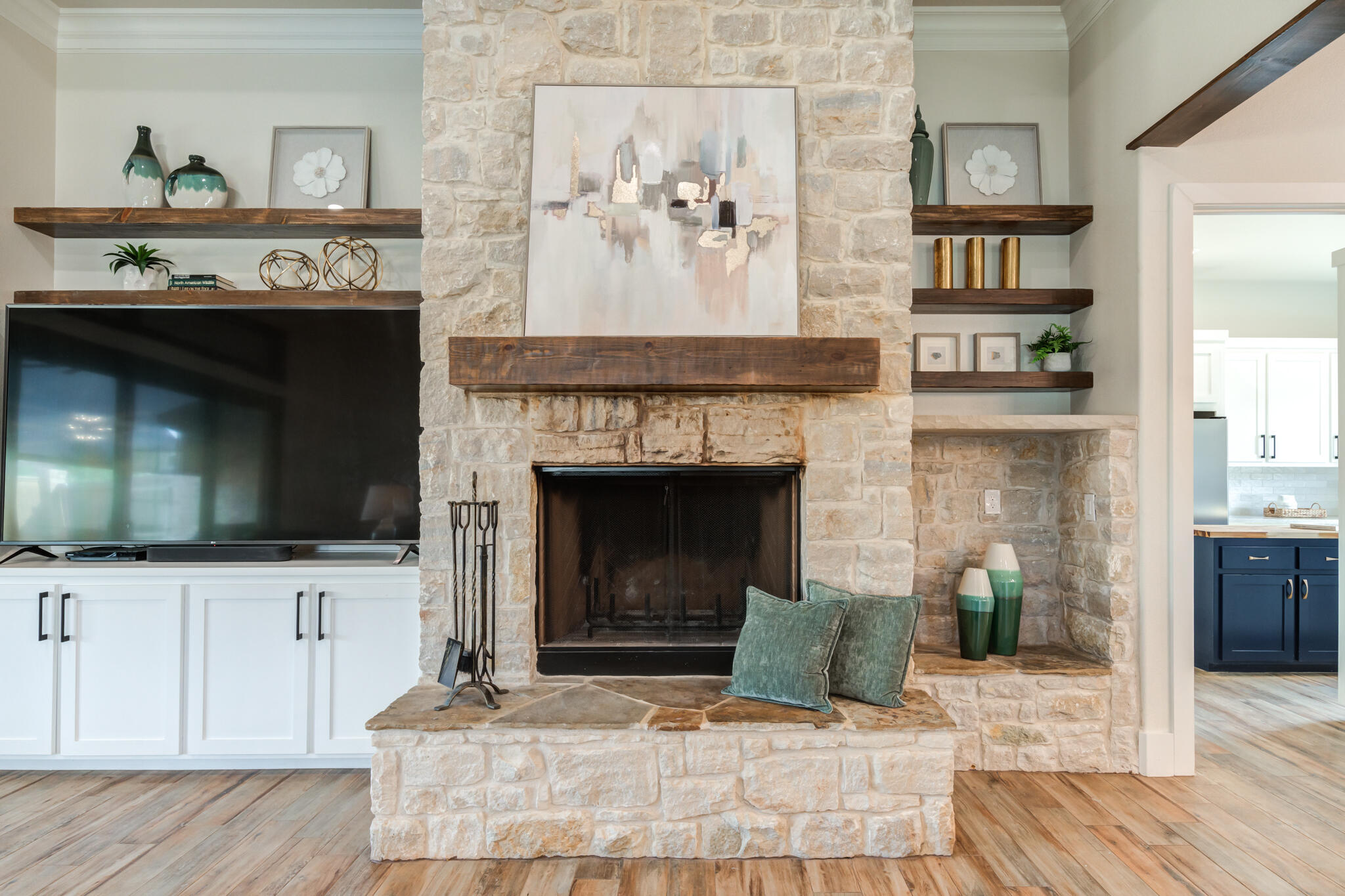 4801 118th Street Lubbock, TX 79424 - Photo 15 of 74 a living room with a fireplace and a flat screen tv
