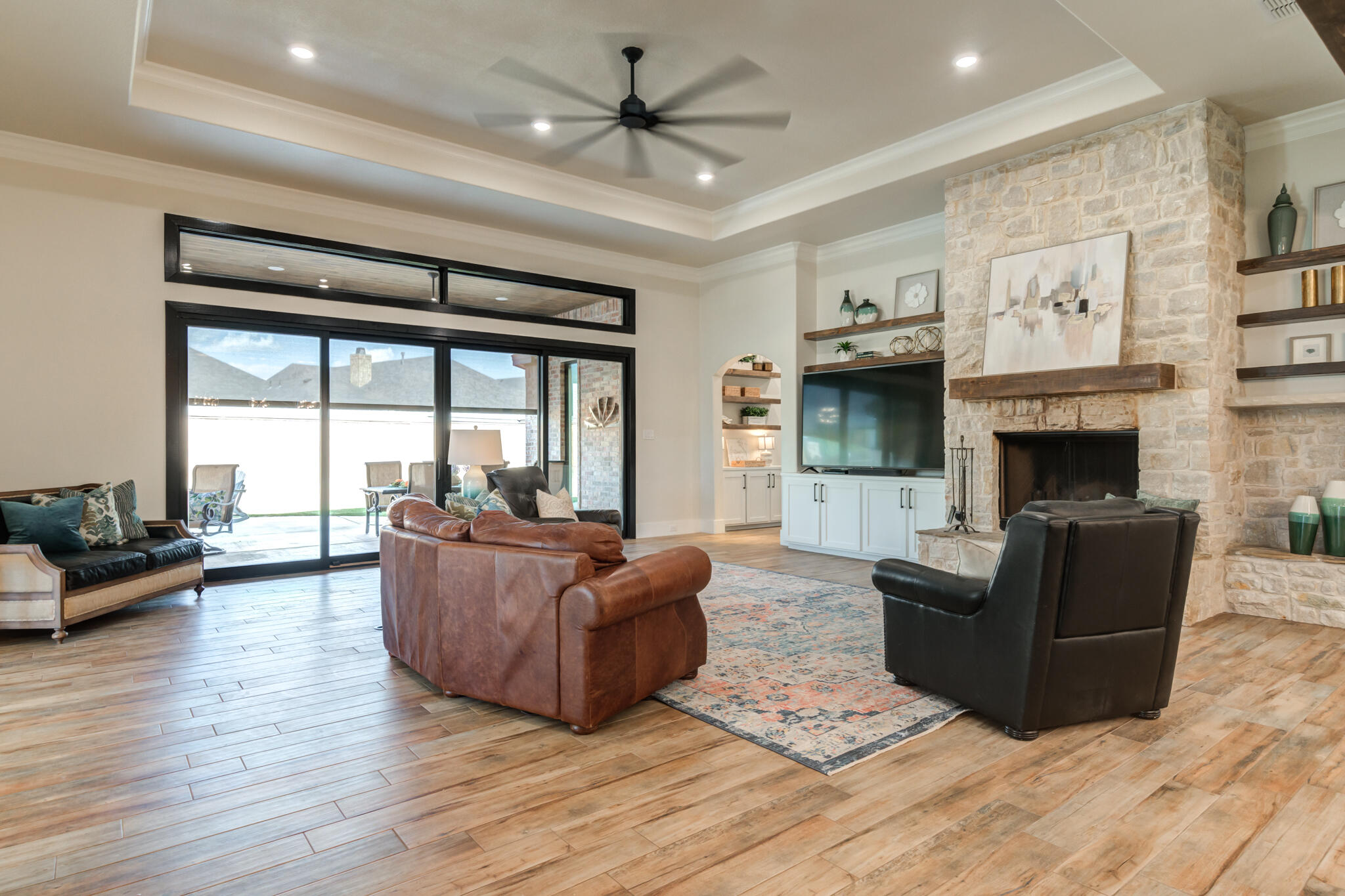 4801 118th Street Lubbock, TX 79424 - Photo 17 of 74 a living room with furniture large window and a fireplace