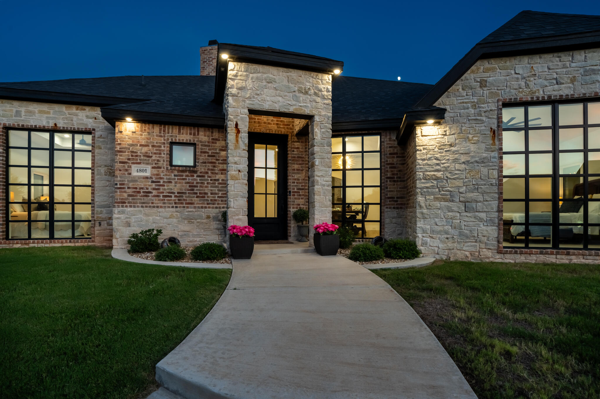 4801 118th Street Lubbock, TX 79424 - Photo 2 of 74 a front view of a house with a yard