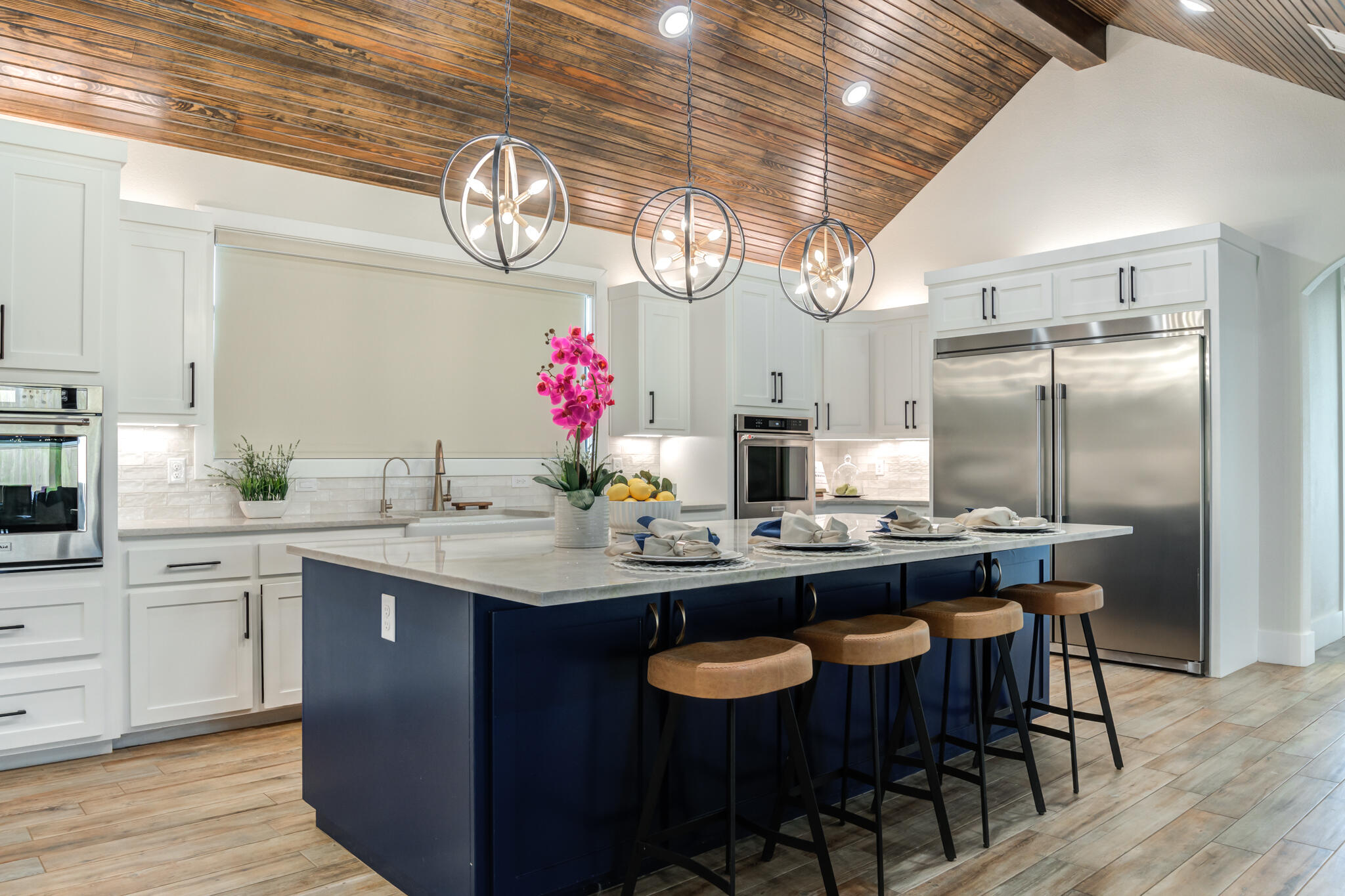 4801 118th Street Lubbock, TX 79424 - Photo 24 of 74 a kitchen with kitchen island granite countertop a sink and cabinets
