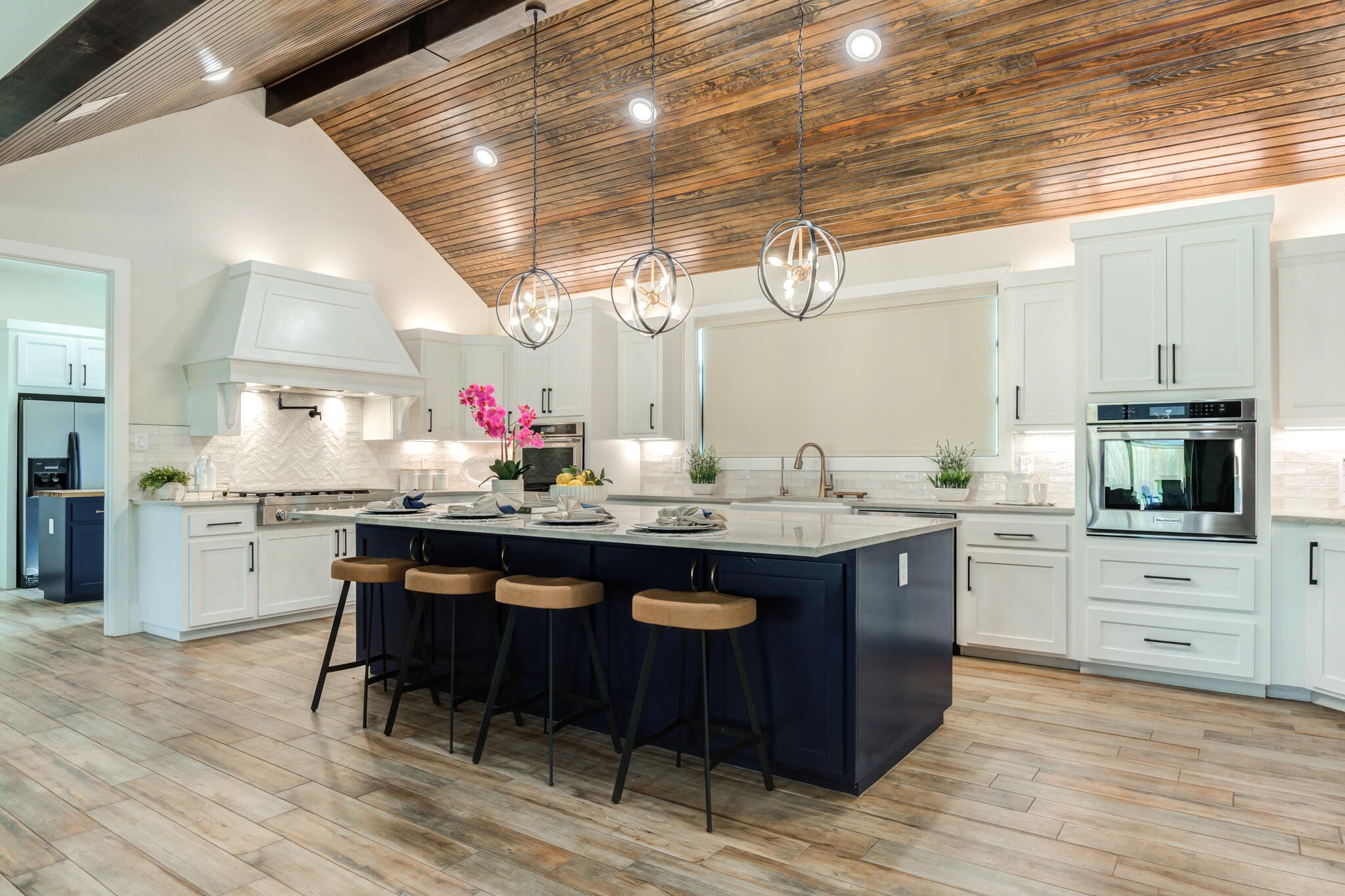 4801 118th Street Lubbock, TX 79424 - Photo 26 of 74 a kitchen with stainless steel appliances granite countertop a sink cabinets and wooden floor