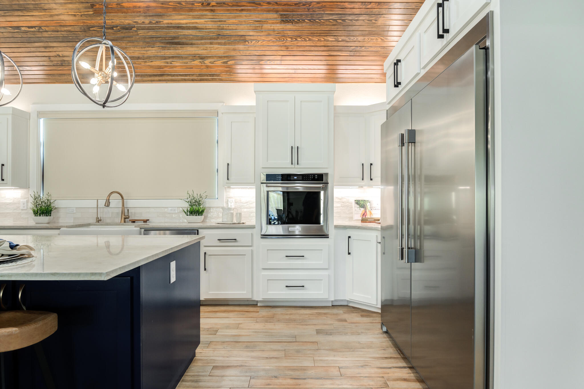 4801 118th Street Lubbock, TX 79424 - Photo 28 of 74 a kitchen with a sink and a refrigerator