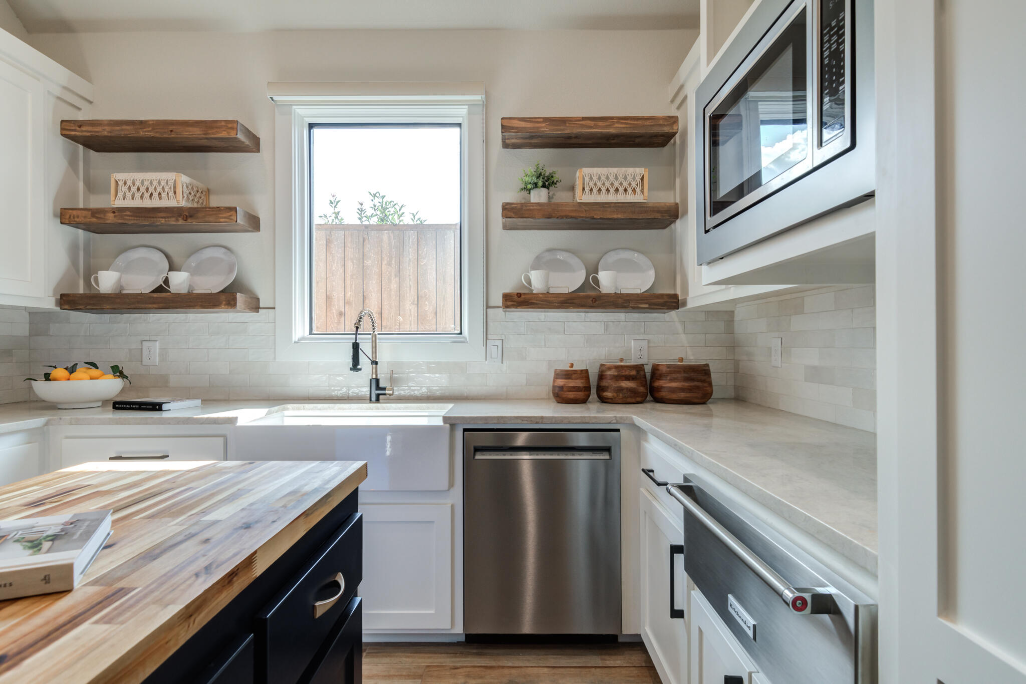4801 118th Street Lubbock, TX 79424 - Photo 36 of 74 a kitchen with a sink stove top oven and cabinets