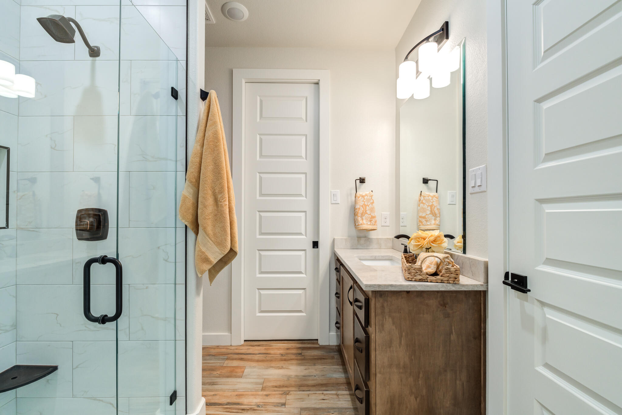 4801 118th Street Lubbock, TX 79424 - Photo 49 of 74 a bathroom with a granite countertop shower and a sink