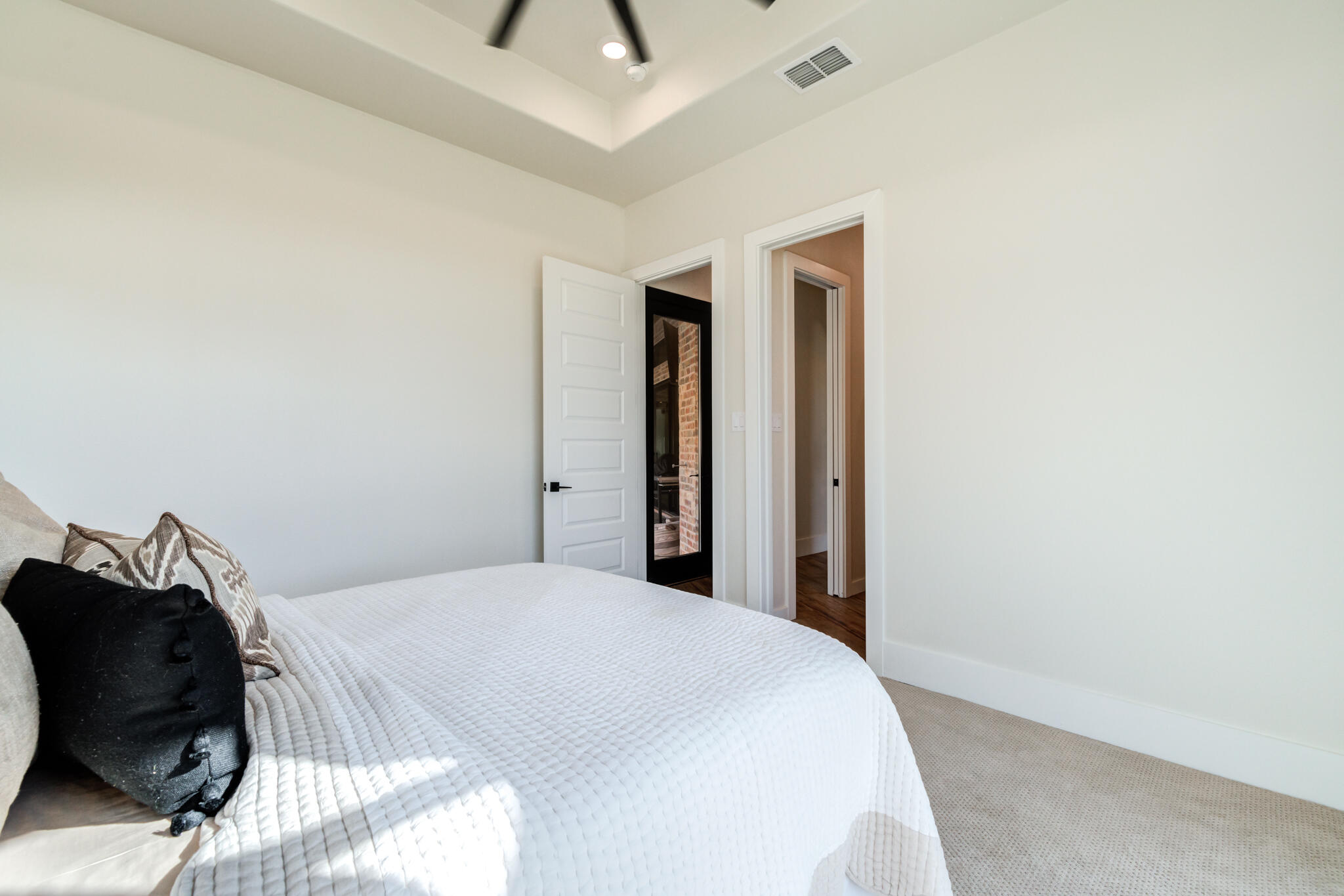 4801 118th Street Lubbock, TX 79424 - Photo 51 of 74 a bedroom with a bed and a painting on the wall