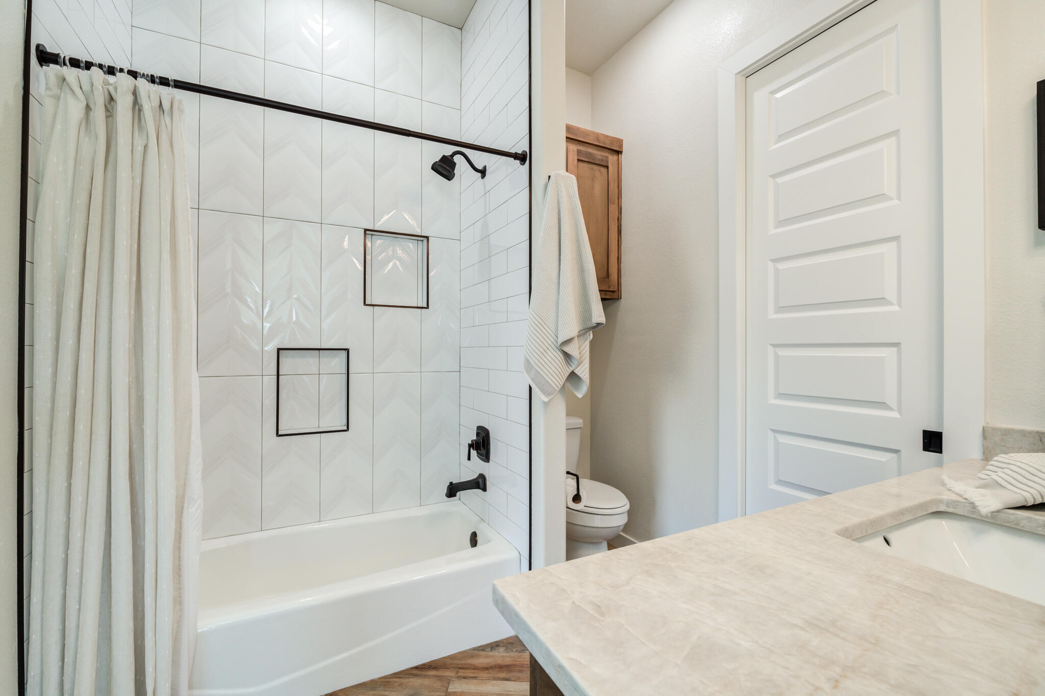 4801 118th Street Lubbock, TX 79424 - Photo 52 of 74 a bathroom with a bathtub and a shower